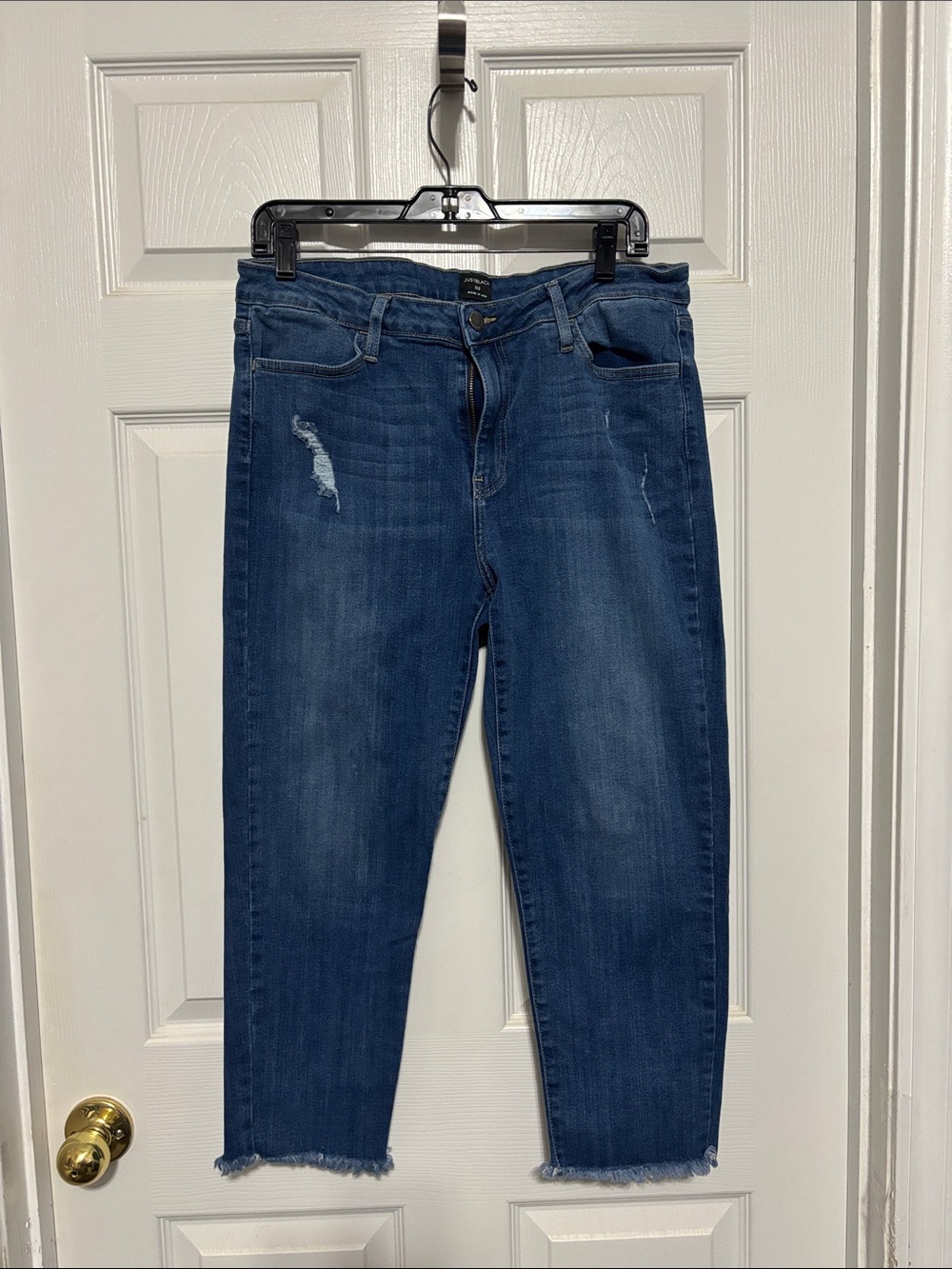 Ladies, just black cropped distressed jeans. Size 32.